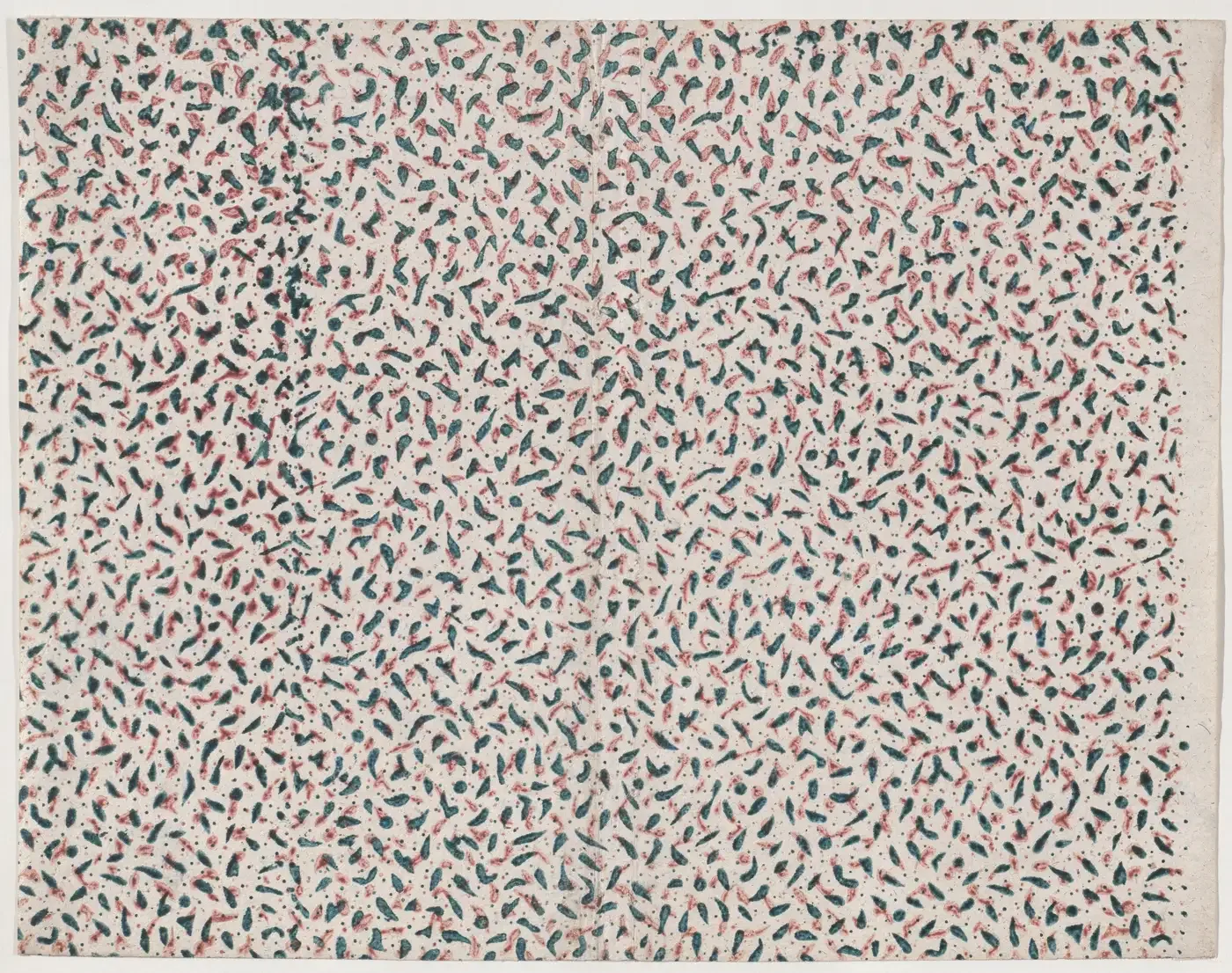 Sheet of paper printed all over with small teal and red flecks on white